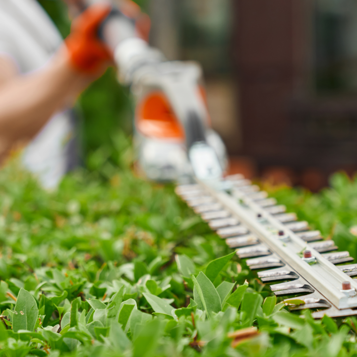 MAN WORKING ON TRIMMING
